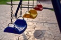 Light morning sun and swings in the park. Royalty Free Stock Photo