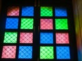 Light from multicoloured stained glass window panes