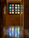 Light from multicoloured stained glass window panes