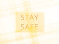 Light neon background with the inscription STAY SAFE