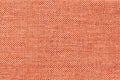 Light orange background of dense woven bagging fabric, closeup. Structure of the textile macro. Royalty Free Stock Photo