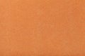 Light orange matt suede fabric closeup. Velvet texture of felt Royalty Free Stock Photo