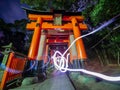 Light painting on Fushimi Inari famous gate at night time