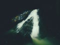 Light painting in night waterfall. White waterfall on mountain stream. Blurred foamy water Royalty Free Stock Photo