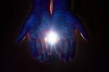 Light through the palms of your hands in ultraviolet, God and religion. Divine light through hand fingers, prophet Muhammad