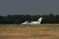 light passenger aircraft of the old model in the field before takeoff Royalty Free Stock Photo