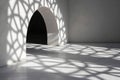 Light passes through stained glass creating shadows on the wall and floor. The pattern appears geometric and casts lines and Royalty Free Stock Photo