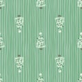 Light pastel green palette seamless pattern with doodle christmas tree toy silhouettes. Striped background Royalty Free Stock Photo