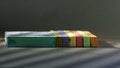 On a dark background, bright, colored crayons.Rainbow colorful chalk pastel for preschool children.Light pattern on the compositio