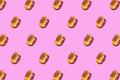 On a light pink background, a pattern of yellow omega 3 capsules. Medical summary. Wallpaper for your phone or canvas