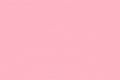 Light pink background from a textile material with pattern, closeup. Perforated cloth backdrop