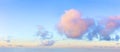 Light pink clouds in the blue sky during dawn sunset, real pastel colors. Panoramic background Royalty Free Stock Photo