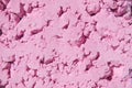 Light pink color powder background. Bright colours for Indian holi festival. Colorful gulal, cosmetic powder. Selective focus, Royalty Free Stock Photo