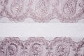 Light pink fabric texture with patterns. Royalty Free Stock Photo