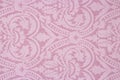 Light pink fabric texture with patterns. Royalty Free Stock Photo