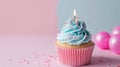 Light pink and light blue cupcake with one candle