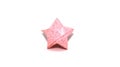 Light Pink origami star with silver glitter Royalty Free Stock Photo