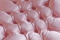 Light pink quilted fabric texture on armchair