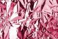 Light pink shiny metallic crumpled texture effect, red wrinkled soft silky background, festive fashion purple glossy art backdrop