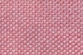 Light pink textile background with checkered pattern, closeup. Structure of the fabric macro. Royalty Free Stock Photo
