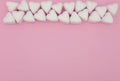 Light pink and white marshmallows close up