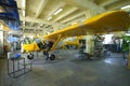 Light planes assembly hall, worker assembling passenger plane