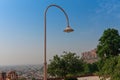 Light pole at beautiful decorated garden of Jaswant Thada cenotaph. Garden has carved gazebos, a tiered garden, and a small lake