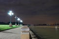 The light from a light pole at night in the park. at Riverwalk, lighting, seating, evening getaway landscape Royalty Free Stock Photo