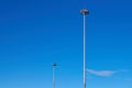 Light poles, copy space. LED light post for parking lot, blue sky background. Lamppost for street lighting at night