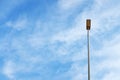 A light post against a clear blue sky. Minimalism, Energy Conservation,  and Soaring High concept Royalty Free Stock Photo