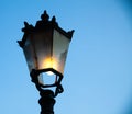 Light post with blue sky background. Vintage outdoor street lights. Cast iron lamp. Victorian large lantern. Lighting pole. Illumi Royalty Free Stock Photo