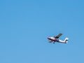 Light private plane is taking off from the runway of a small airfield on a sunny summer day Royalty Free Stock Photo