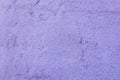 Light purple granular concrete wall with a relief. rough surface texture Royalty Free Stock Photo