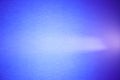 Light purple ray of light crosses a light blue background Royalty Free Stock Photo