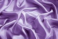 Light purple silk satin. Shiny smooth fabric. Wavy folds. Elegant lilac background with space for design. Royalty Free Stock Photo