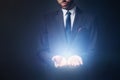 Light radiating from businessman hands