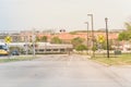 Light rail train speeding through a red alert sign level crossing Royalty Free Stock Photo