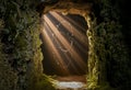 Light rays entering from a narrow cave opening, dust floating in loop Royalty Free Stock Photo