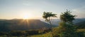 Light Rays Streaming through Clouds over Mountain Range Royalty Free Stock Photo