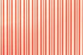 Light red and golden background from wrapping striped paper Royalty Free Stock Photo