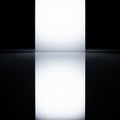 The light is reflected symmetrically on a glossy surface, creating Royalty Free Stock Photo