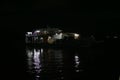 The light reflection of a goods ferry on the Amazon river during night time , at the busy port of Manaus, Brazil Royalty Free Stock Photo