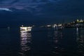 The light reflection of several goods ferries on the Amazon river during dawn, at the busy port of Manaus, Brazil Royalty Free Stock Photo