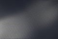 Light reflection on surface of grey woven carbon fibre composite material Royalty Free Stock Photo