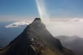 light refraction creating a brocken spectre on a mountain peak Royalty Free Stock Photo