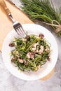 Light salad with agretti, a spring vegetable from Italy, tuna, black olives and olive oil for slimming and weight loss Royalty Free Stock Photo
