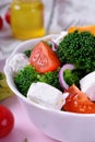 Light salad with broccoli, cherry tomatoes and feta cheese Royalty Free Stock Photo