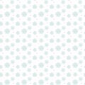 Light seamless blue pattern of many snowflakes on white background. Soft Christmas winter theme for gift wrapping. New Year