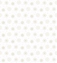 Light seamless gold pattern of many snowflakes on white background. Soft Christmas winter theme for gift wrapping. New Year