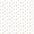 Light seamless gold pattern of many snowflakes on white background. Soft Christmas winter theme for gift wrapping. New Year Royalty Free Stock Photo